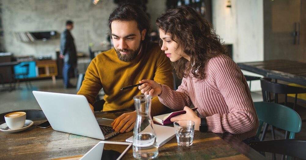 couple on laptop coffee