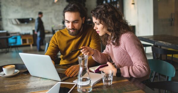 couple on laptop coffee