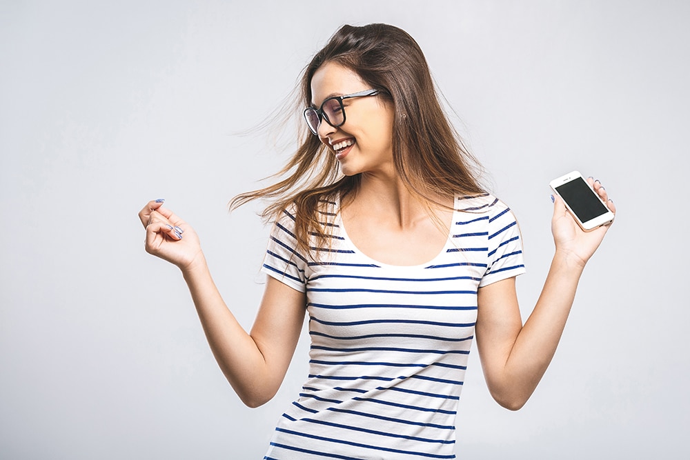woman dancing with phone