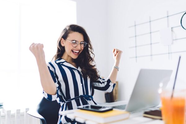 excited woman laptop